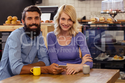 Portrait of a lovely couple using a smartphone