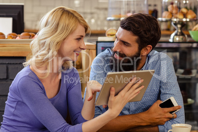 Couple using a tablet computer