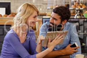 Couple using a tablet computer