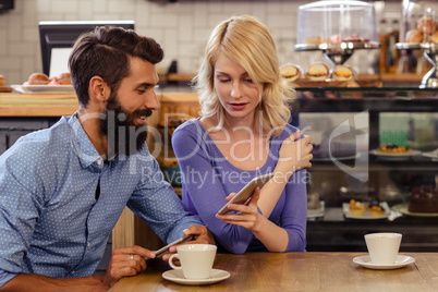 Couple using smartphones