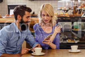 Couple using smartphones