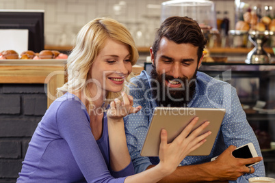 Couple using a tablet computer