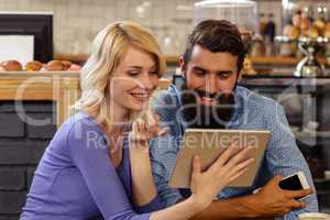 Couple using a tablet computer