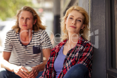 Portrait of a couple sitting on a terrace