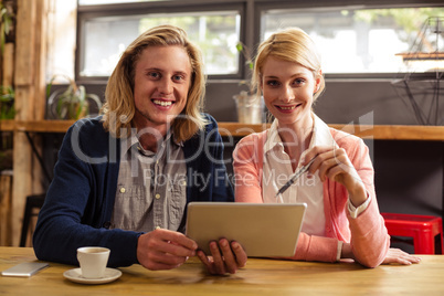 Colleagues using a tablet computer