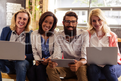 Portrait of a team of hipsters with laptop