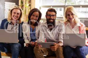 Portrait of a team of hipsters with laptop
