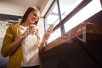 Casual woman using a smartphone