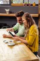 Couple using a tablet computer