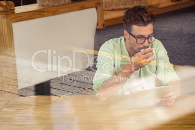 Hipster using a tablet computer