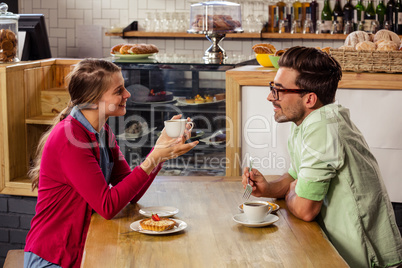 Couple sitting at table and talking