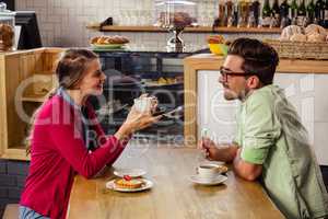 Couple sitting at table and talking