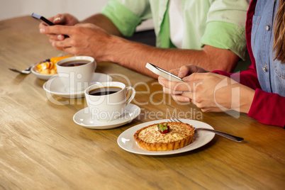 Couple using smartphones