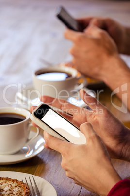 Couple using smartphones