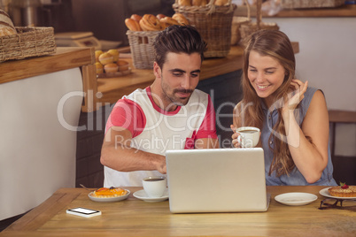 Couple using a laptop