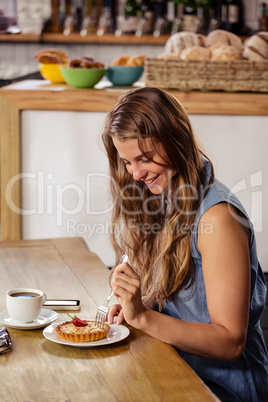 Casual girl eating a dessert
