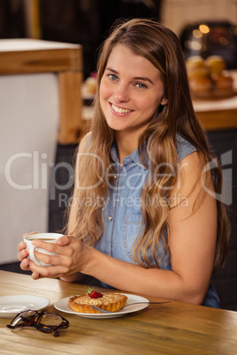 Casual girl eating a dessert