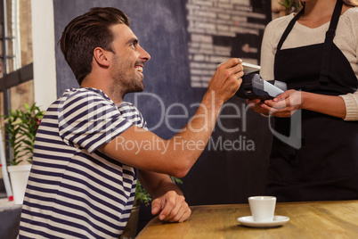 Waitress collecting payment