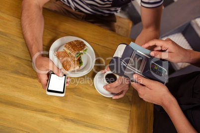 Waitress collecting payment