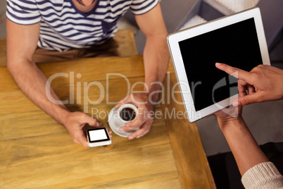 Waitress taking order with a tablet computer