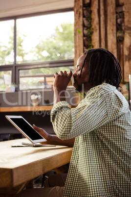 Hipster using a tablet computer