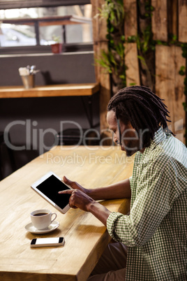 Smiling man using a tablet