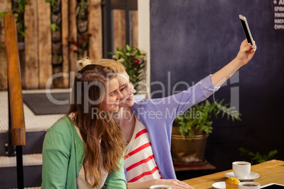 Smiling friends taking a selfie