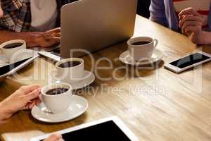 Focus on laptop with coffee