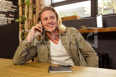 Happy man using his smartphone