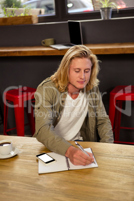 Man writing on his clipboard