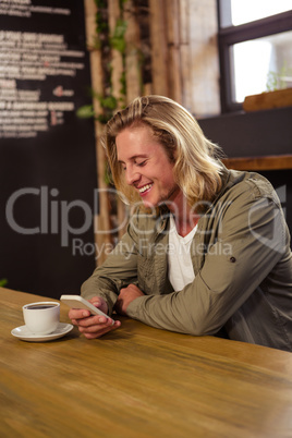 Happy man using a smartphone