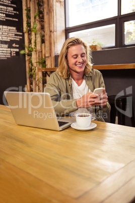 Happy man using a smartphone