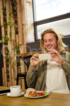 Happy man taking his meal in picture