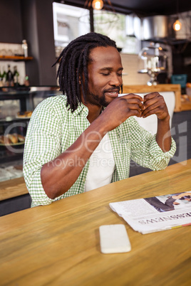 Man drinking a cup of coffee