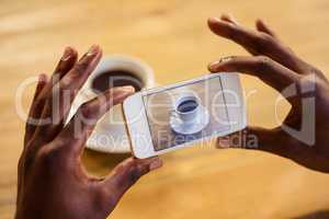 Man taking picture of a coffee