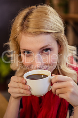 Woman drinking a cup of coffee