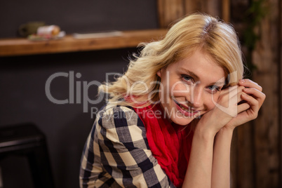 Portrait of young woman in cafeteria