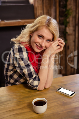 Portrait of young woman in cafeteria