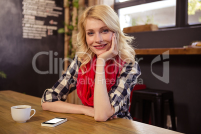 Portrait of young woman in cafeteria