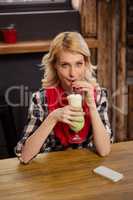 Young woman drinking mocktail