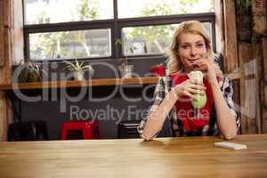 Young woman drinking mocktail