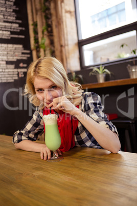 Woman drinking a milkshake