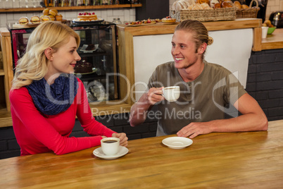 Couple having a drink together