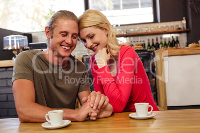 Couple holding hands together