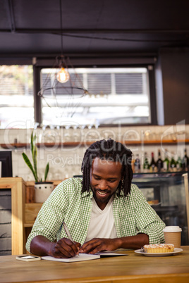 Man writing in a notebook