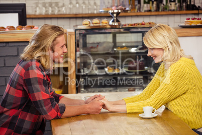 Couple holding hands together