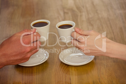 Couple cheering with espresso