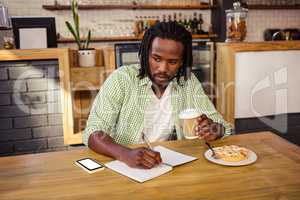 Man writing in a notebook