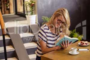Woman reading a book sitting