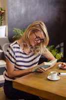 Woman reading a book sitting